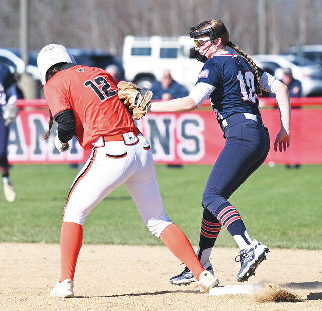 <p>Pittston Area second baseman Kelcey Podwika (10) tries to double up Tunkhannock’s Taryn Newswanger (12) at second base after Podwika caught a pop fly.</p>
<p>Tony Callaio | For Times Leader</p>