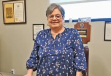 
			
				                                Dupont Mayor Elaine Lello proudly stands at the desk used by her husband, the former mayor, Dan Lello. Elaine fulfilled her husbands term and then successfully ran, being elected last November, taking office on Jan. 1, 2026.
                                 Tony Callaio | For Sunday Dispatch

			
		