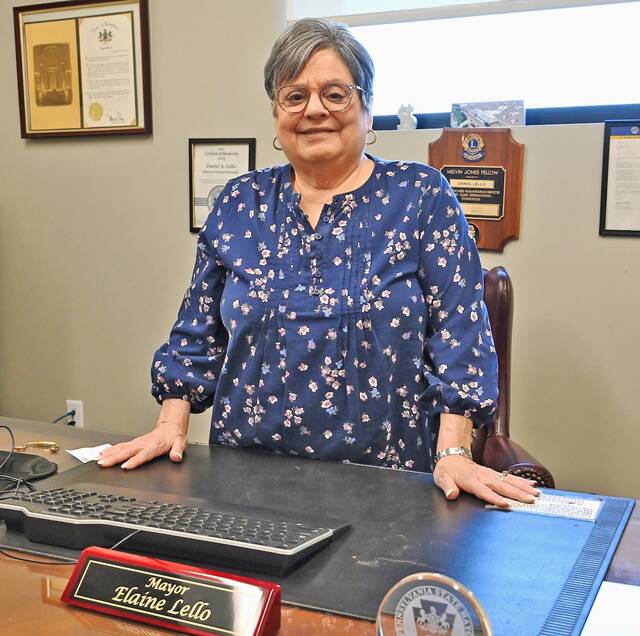 132268340_web1_Dupont-Mayor-Elaine-Lello-1
Dupont Mayor Elaine Lello proudly stands at the desk used by her husband, the former mayor, Dan Lello. Elaine served out her husbands term and then successfully ran, being elected last November and taking office on Jan. 1, 2026.
Tony Callaio | For Sunday Dispatch