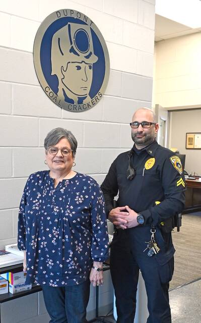 <p>As mayor of Dupont, Elaine Lello oversees the police department. She stands with Cpl. John Tamburello, a member of the police force. There are five full-time officers and one part-time officer.</p>
<p>Tony Callaio | For Sunday Dispatch</p>