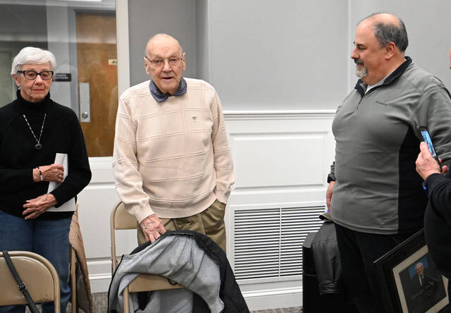 132268589_web1_George-Miller-Retires-1
George Miller, 95, center, addresses the audience at the West Pittston Council meeting on Wednesday night after accepting a plaque from West Pittston Mayor Angelo Alfano, right, with Georges wife Lois standing to his right.
Tony Callaio | For Sunday Dispatch