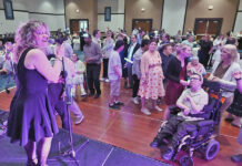 
			
				                                Flaxy Morgan lead singer Nina Sapiego belts out another number to the delight of the athletes of the Victory Sports League players at the Mohegan Sun ballroom on Thursday evening.
                                 Tony Callaio | For Sunday Dispatch

			
		