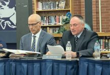 
			
				                                Attorney Samuel Falcone, the solicitor of the Pittston Area School District, sits beside Assistant Superintendent John Haas as reads his report.
                                 Sydney Allabaugh | Sunday Dispatch

			
		