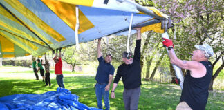 
			
				                                Mark Farrell, far right, one of the principal owners of Big Top Rentals, the major sponsor of the 55th Annual West Pittston Cherry Blossom Festival, along with co-workers, erects the second-largest tent for the festival this weekend, May 2 and May 3.
                                 Tony Callaio | For Sunday Dispatch

			
		