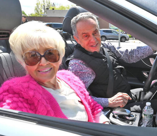 
			
				                                West Pittston Cherry Blossom Festival Grand Marshals Mary Ann and Sam Polit drive in the festival parade on Saturday.
                                 Tony Callaio | For Sunday Dispatch

			
		