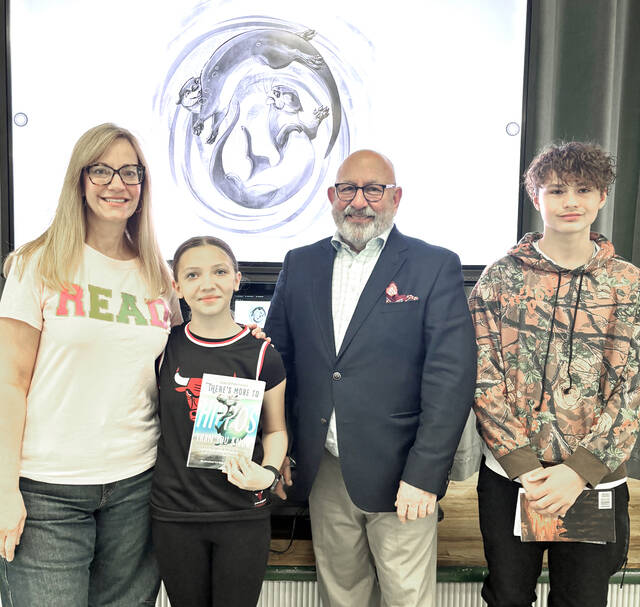 <p>Local author David Parmelee signed copies of his book of poetry for Wyoming Area Intermediate Center sixth grade student authors. From left: Faculty member Melissa Stevens, student Payton Pavinski, Parmellee, and student Ben Serkosky.</p>
<p>Submitted Photo</p>