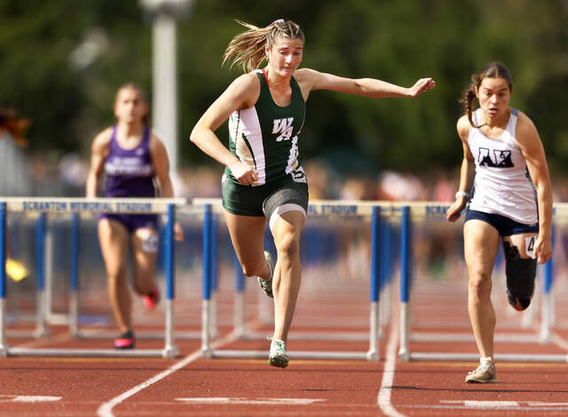 <p>Wyoming Area’s Lucia Campenni wins her heat in the Girls AAA 100 Meter Hurdles on Monday.</p>
<p>Fred Adams | For Times Leader</p>