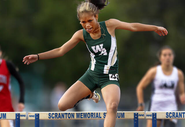 <p>Wyoming Area state qualifier Jenesa Sancho wins in the Girls AAA 300 Meter Hurdles final on Monday.</p>
<p>Fred Adams | For Times Leader</p>