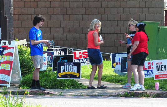 
			
				                                A voter stops to chat with poll workers Tuesday at the Kingston Recreation Center.
                                 Mark Moran | For Times Leader

			
		