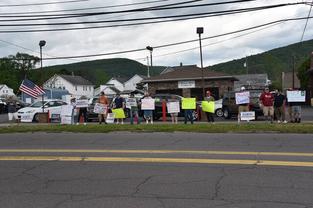 <p>Protesters line the sidewalk across the street from The Avenue Restaurant and Catering in Wyoming, where Gov. Josh Shapiro and Scranton mayor and congressional candidate Paige Cognetti held a campaign event Wednesday afternoon.</p>
<p>Liz Baumeister | Sunday Dispatch</p>