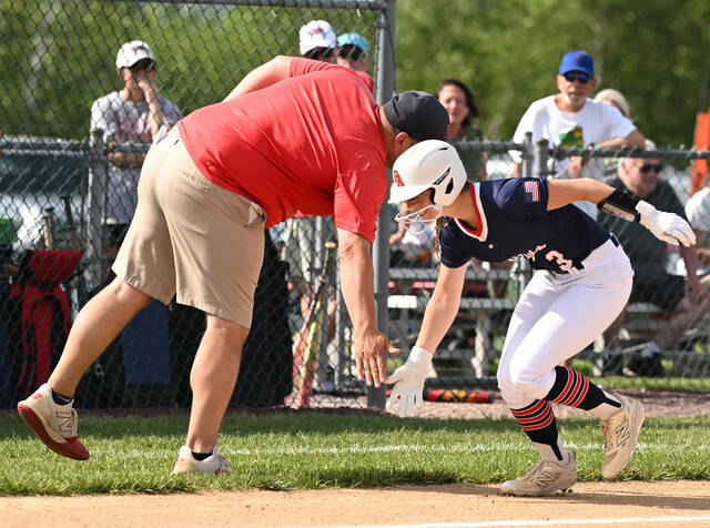 <p>Pittston Area’s Gabby Roman receives a low five from third base coach Anthony Bellino after Roman hit a home run against Shikellamy at home.</p>
<p>Tony Callaio | For Sunday Dispatch</p>