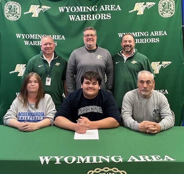 132374471_web1_IMG_1179
Wyoming Area football player Tyler Lanunziata has committed to continue his academic and athletic careers at Misericordia University. The two-way tackle made three tackles for losses as a senior while helping the Warriors to a 9-2 season. From left, first row: Denise Lanunziata, mother; Tyler Lanunziata; and Paul Lanunziata, father. Second row: Warriors head coach Randy Spencer; Dr. Jon Pollard, superintendent; and Joe Pizano, athletic director.
Submitted Photo