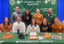 WA’s Orlandini commits to Waynesburg
Kierstyn Orlandini has committed to continuing her academic and athletic careers as a runner for Waynesburg University. The Wyoming Area senior intends to be part of the cross country and track and field teams. From left, first row: Sarah Orlandini, Roger Orlandini, Kierstyn Orlandini, Melody Orlandini, and Ryan Orlandini. Second row: Jon Pollard, Wyoming Area superintendent; Kristen Lombardo, coach; Mike Branley, cross country coach; and Joe Pizano, track coach and athletic director.
Submitted Photo