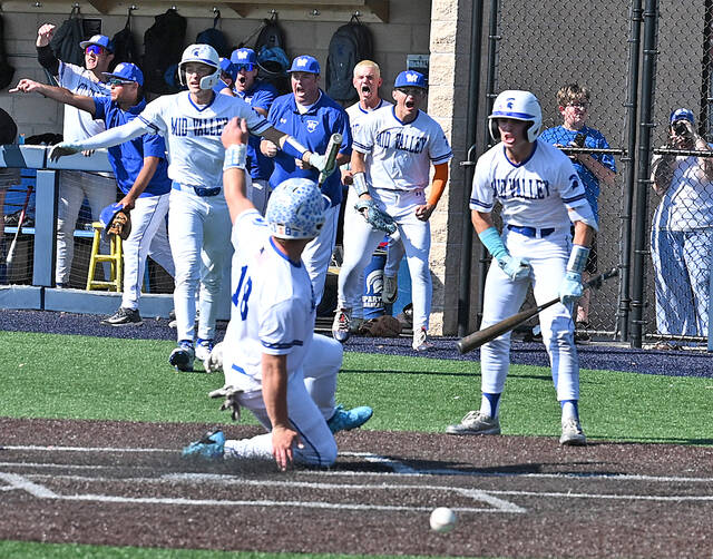 <p>Mid Valley’s Jake Bondy scores on a wild throw to the plate in the second inning as his teammates cheering him on.</p>
<p>Tony Callaio | For Times Leader</p>