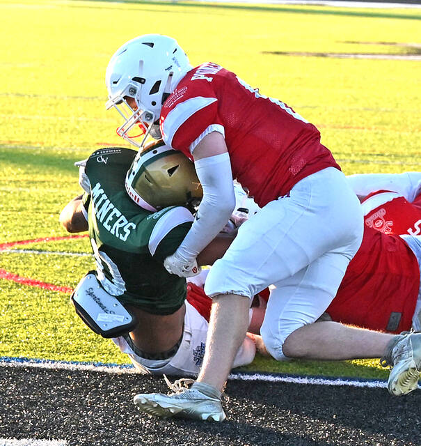 <p>Wyoming Area’s Trustin Johnson (0) twisted and turned his way into the end zone, putting the UNICO Miners on the scoreboard Thursday night at Wilkes-Barre Area.</p>
<p>Tony Callaio | For Times Leader</p>