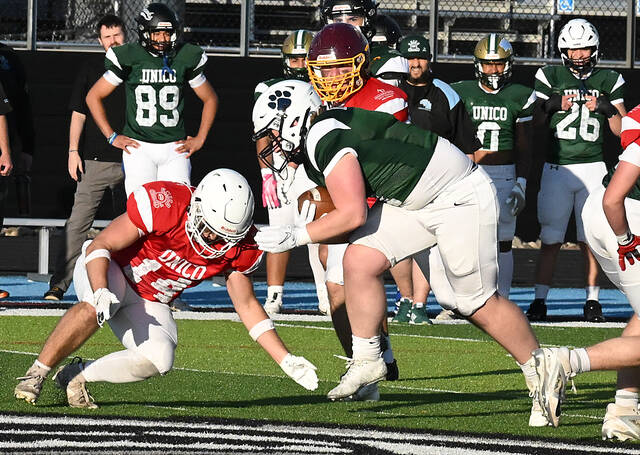 <p>The Wolfpack’s Davon Underwood, playing his last game on his home turf during the 75th UNICO game, breaks through into the Pioneers’ deensive back field for the Miners.</p>
<p>Tony Callaio | For Times Leader</p>