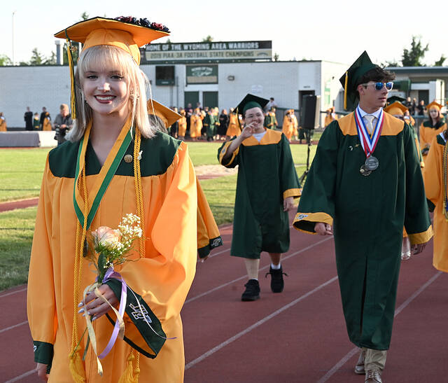 <p>Wyoming Area graduating senior Sara Pealer smiles brightly for the camera as she and her classmates process into the stadium.</p>
<p>Tony Callaio | For Times Leader</p>
