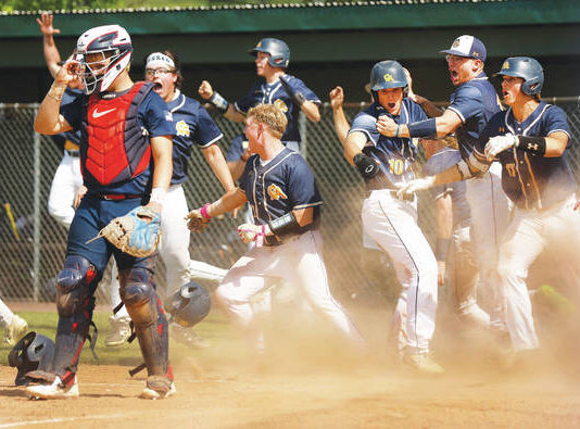 
			
				                                Pittston Area catcher Jacoby Harnen removes his mask as Greencastle-Antrim players react to the winning run crossing the plate in the bottom of the seventh.
                                 Fred Adams | For Sunday Dispatch

			
		