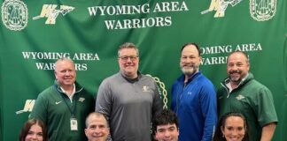 
			
				                                Wyoming Areas Nick Ciampi committed to Susquehanna University to continue his academic and football careers. From left, first row: Mia Ciampi, Lou Ciampi, Nick Ciampi, and Lisa Ciampi. Second row: Randy Spencer, Wyoming Area head coach; Dr. Jon Pollard, superintendent; Ken Kopetchny, assistant coach; and Joe Pizano, head coach.
 
			
		