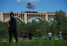
			
				                                People photograph the steam locomotive Union Pacifics Big Boy No. 4014, as it passes its travels across the Tunkhannock Creek Viaduct in Nicholson on Saturday, as part of a coast-to-coast tour to celebrate Americas 250th anniversary.
                                 AP Photo

			
		