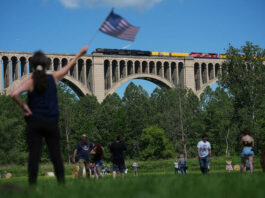 
			
				                                People photograph the steam locomotive Union Pacifics Big Boy No. 4014, as it passes its travels across the Tunkhannock Creek Viaduct in Nicholson on Saturday, as part of a coast-to-coast tour to celebrate Americas 250th anniversary.
                                 AP Photo

			
		