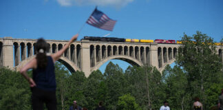 
			
				                                People photograph the steam locomotive Union Pacifics Big Boy No. 4014, as it passes its travels across the Tunkhannock Creek Viaduct in Nicholson on Saturday, as part of a coast-to-coast tour to celebrate Americas 250th anniversary.
                                 AP Photo

			
		