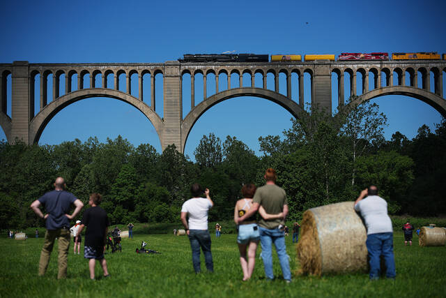 <p>People watch as the steam locomotive Union Pacific’s Big Boy No. 4014 travels across the Tunkhannock Creek Viaduct in Nicholson on Saturday, as part of a coast-to-coast tour to celebrate America’s 250th anniversary.</p>
<p>AP Photo</p>
