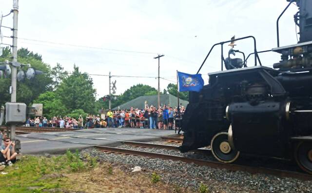 <p>Onlookers crowd around the Oak Street rail crossing to watch as Big Boy No. 4014 passes through Pittston Twp.</p>
<p>Margaret Roarty | Times Leader</p>