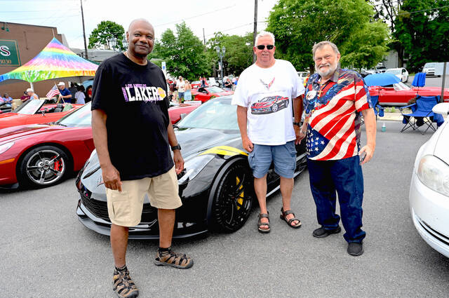 <p>Corvette car owner Ben Walker, left, was visited by GAR Class of 1977 classmates Phil Bozek, center, and Tim Nulton, as they stand in front of Walker’s C7 Corvette.</p>
<p>Tony Callaio | For Sunday Dispatch</p>