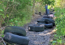 Cleaning up the railroad tracks
Clean up organizer Josh Maguire, right, along with his late brother, Jake, collected over 50 tires, 17 trash bags of garbage, mattresses, and box springs along the railroad track in Exeter. All told, over 2,000 lbs. of trash was hauled away.
Submitted Photo
