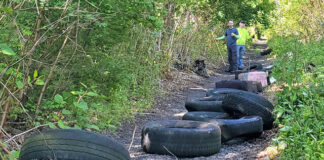 
			
				                                Clean up organizer Josh Maguire, right, along with his late brother, Jake, collected over 50 tires, 17 trash bags of garbage, mattresses, and box springs along the railroad track in Exeter. All told, over 2,000 lbs. of trash was hauled away.
                                 Submitted Photo

			
		