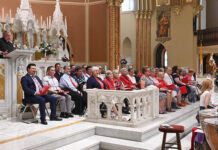 
			
				                                St. John the Evangelist Pastor Fr. Joseph Elston, far left, welcomes the audience gathered for the annual Independence Day Concert at the church on Monday, June 29.
                                 Tony Callaio | For Sunday Dispatch

			
		