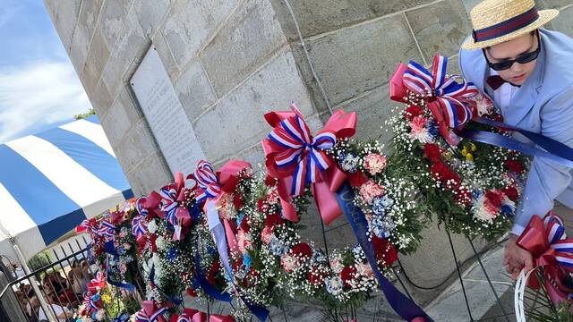 <p>More than 60 wreaths and floral arrangements were presented as tributes during the ceremony by dozens of area groups and descendants for placement around the Wyoming Monument.</p>
<p>Marcella Kester | For Sunday Dispatch</p>